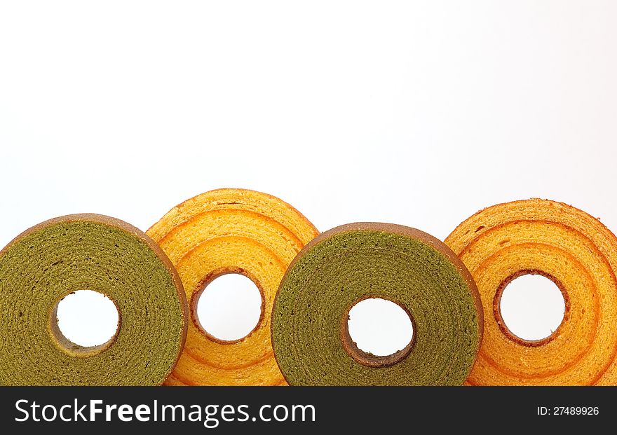 Sponge cake  orange and green tea   isolated on white background. Sponge cake  orange and green tea   isolated on white background