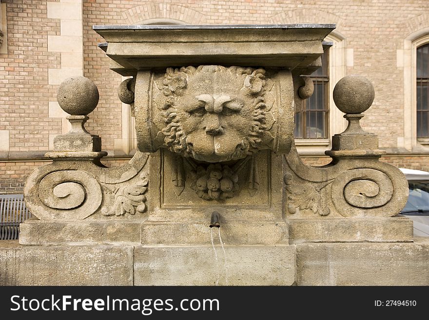 Ancient fountain with a lion