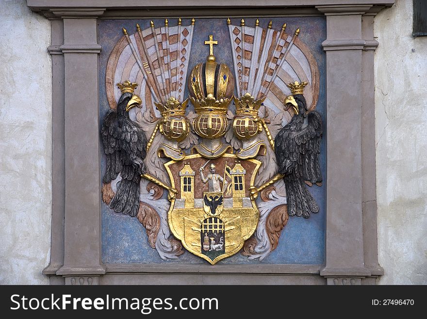 Exterior decoration of the house, coat of arms with the knight and two black eagles