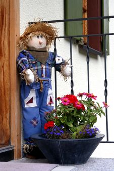 Cute Scarecrow Outside A House Royalty Free Stock Photos