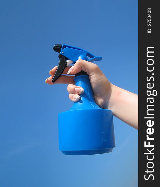 sprayer of water on blue background