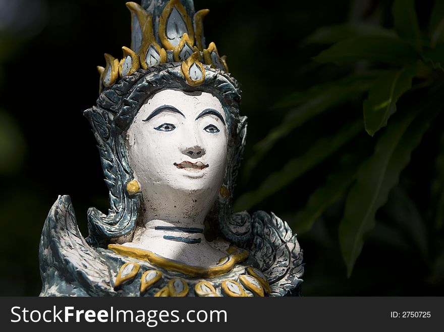 Figure In Buddhist Temple