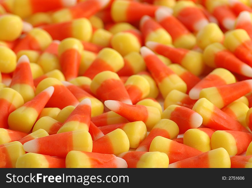 Many candy corns, sharp focus in front and blurred to back. Many candy corns, sharp focus in front and blurred to back.