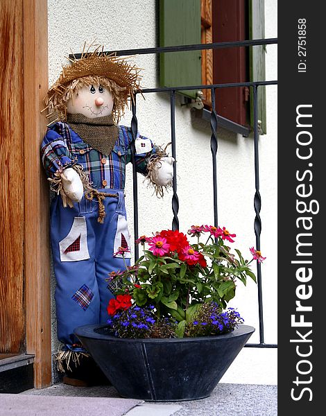 Cute Scarecrow outside a house