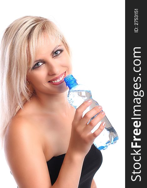 Blond with towel holding bottled water on white. Blond with towel holding bottled water on white