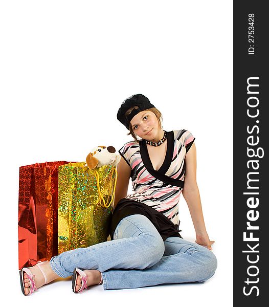 Happy young girl with shopping bags. Isolate on white. Happy young girl with shopping bags. Isolate on white.