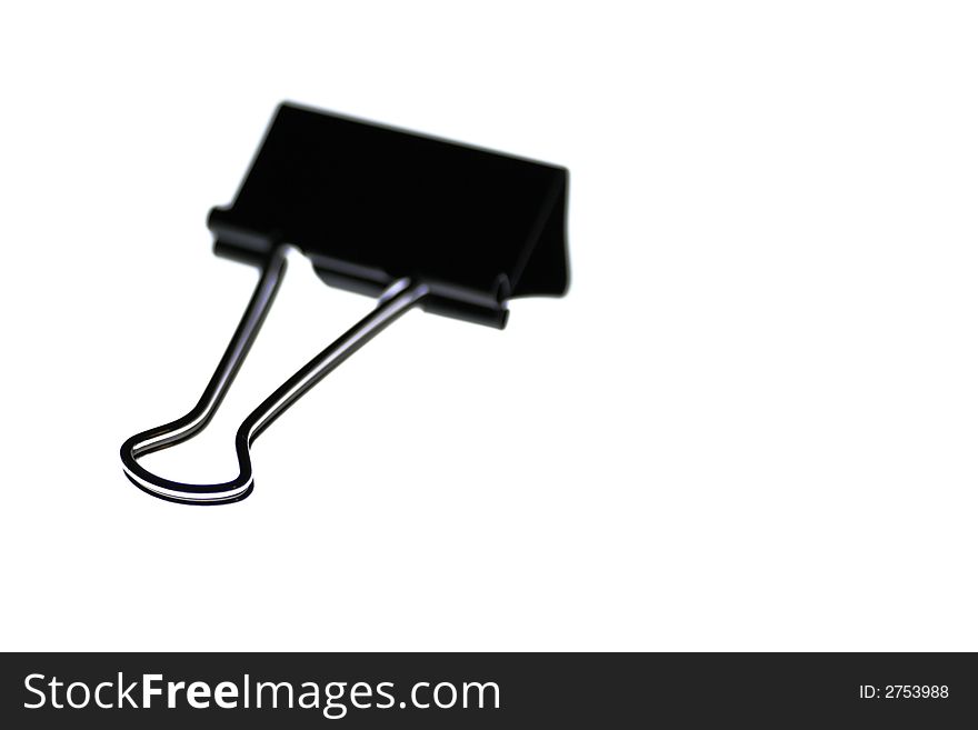 Black Metal Paper Clip On A White Background, Office Object, Stationery