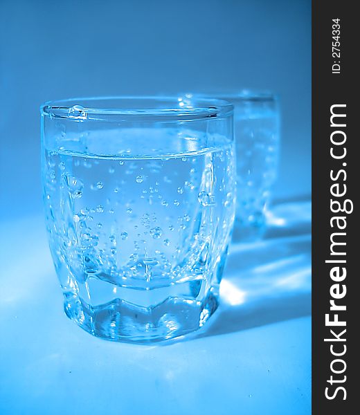 Glass With Water In Blue Color