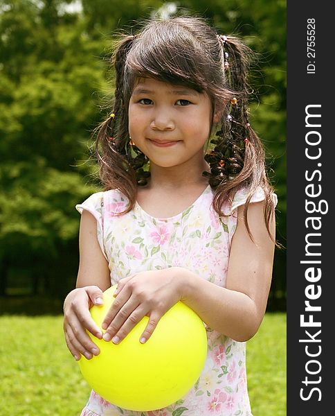 Girl Holding Yellow Ball