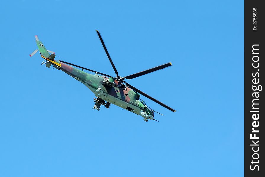 Helicopter Mi-24 opposite blue sky