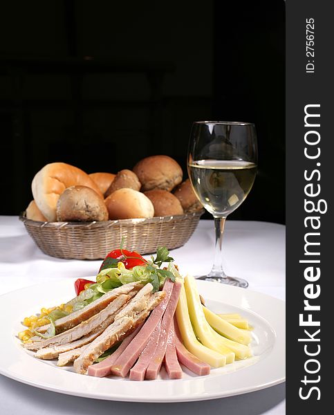 Delicious chicken and ham salad served with bread and white wine, copy space included. Delicious chicken and ham salad served with bread and white wine, copy space included