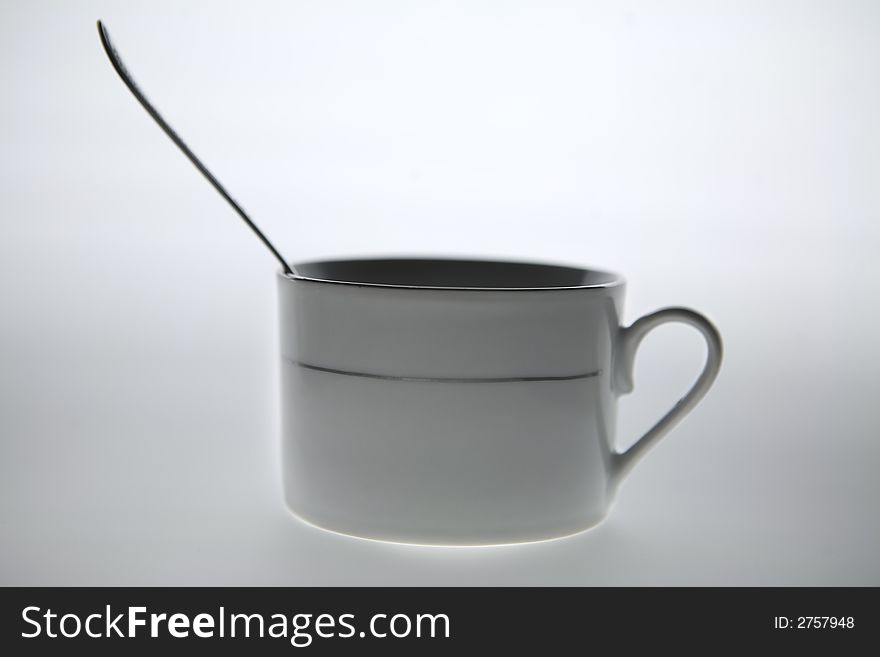 Isolated - white coffee mug with the cup into it. Isolated - white coffee mug with the cup into it