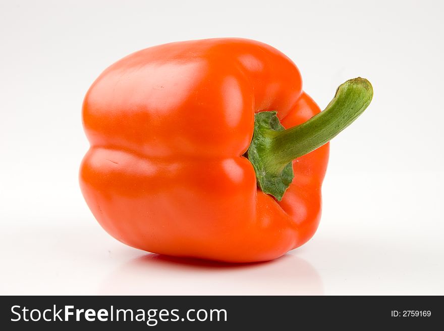 Perfect orange bell pepper isolated on white