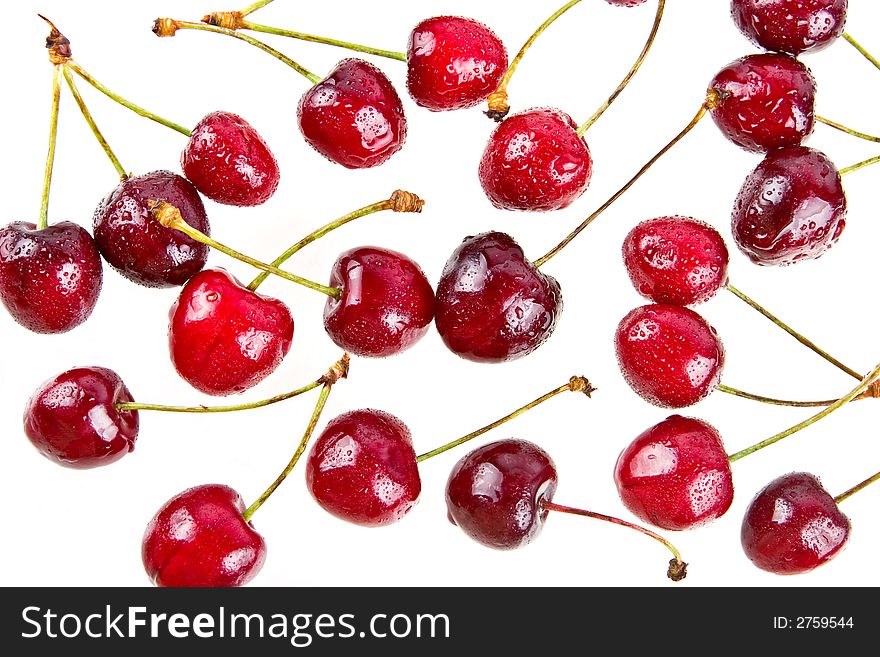 Cooled sweet cherries in drops of waters shined from below. Cooled sweet cherries in drops of waters shined from below