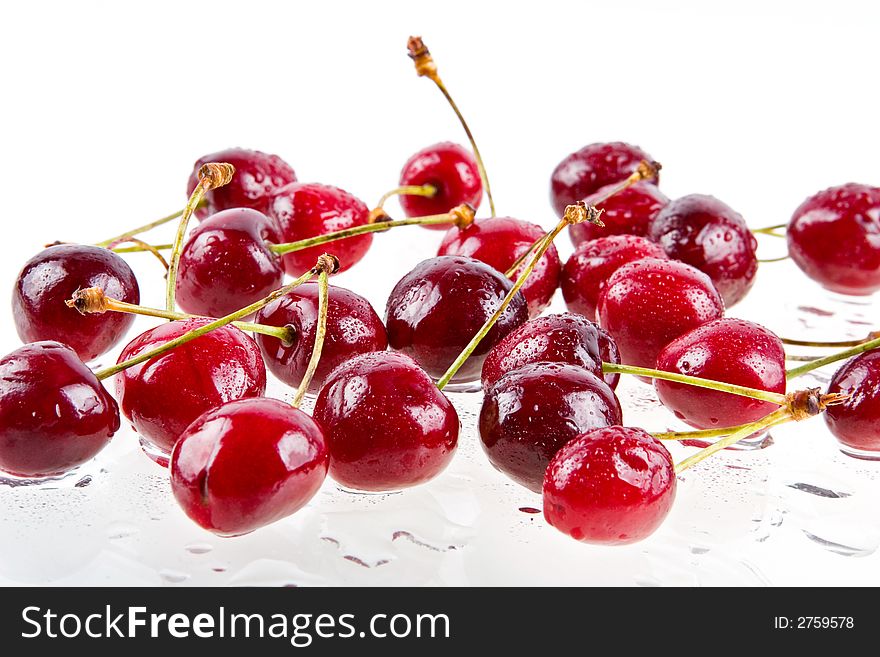 Cooled sweet cherries in drops of waters shined from below. Cooled sweet cherries in drops of waters shined from below