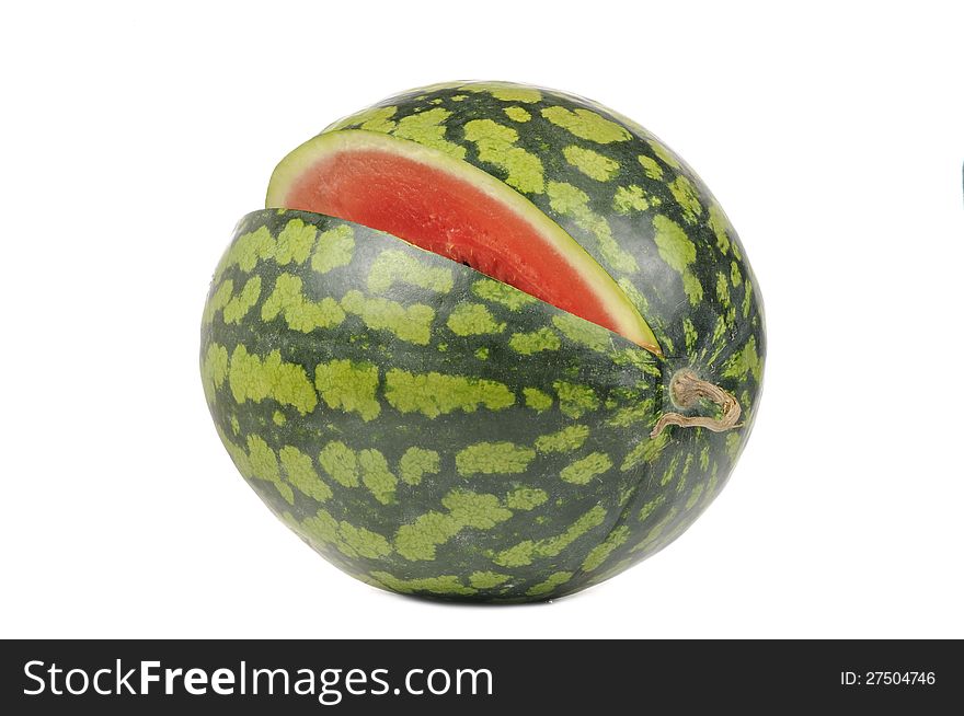 A watermelon with a missing slice isolated on a white background. A watermelon with a missing slice isolated on a white background