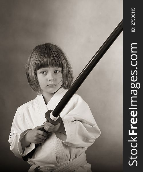 Little girl practice karat with the sword. Little girl practice karat with the sword