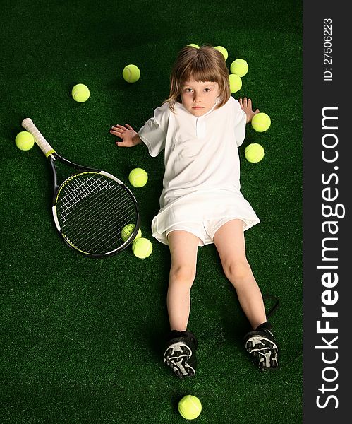 Girl with tennis balls on green background. Girl with tennis balls on green background