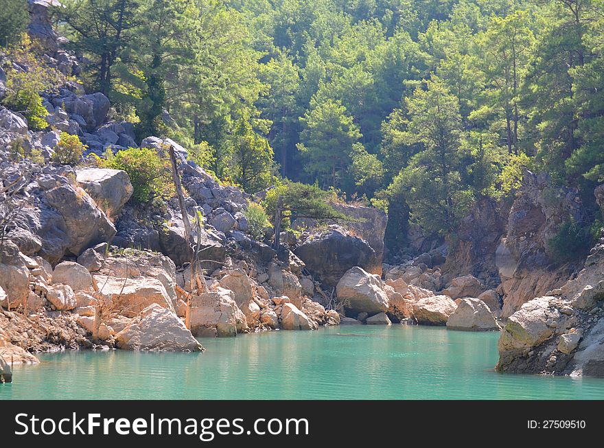 Rocky mountains, trees, sky and water. Rocky mountains, trees, sky and water