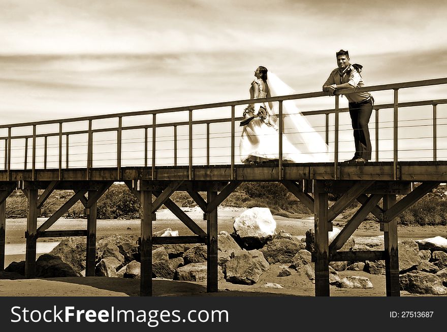 Grooms walking on the beach