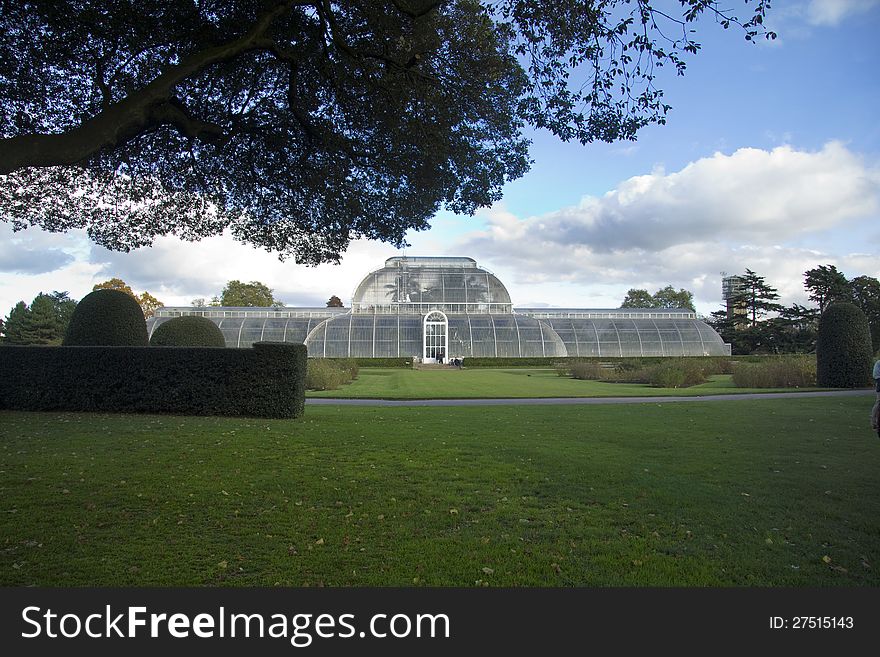 The famous glass Palm House at the Royal Botanical gardens at Kew. It was the first large-scale structural use of wrought iron. The structure's panes of glass are all hand-blown. The famous glass Palm House at the Royal Botanical gardens at Kew. It was the first large-scale structural use of wrought iron. The structure's panes of glass are all hand-blown.