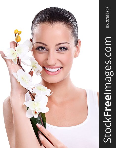 Beautiful Smiling woman posing with white orchid next her face. Beautiful Smiling woman posing with white orchid next her face