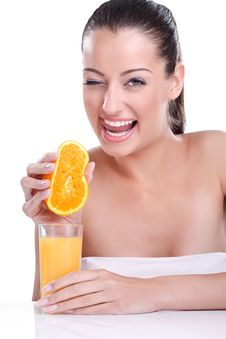 Smiling Woman Squeezes Orange Stock Photos Smiling Woman Squeezes Orange Stock Photos