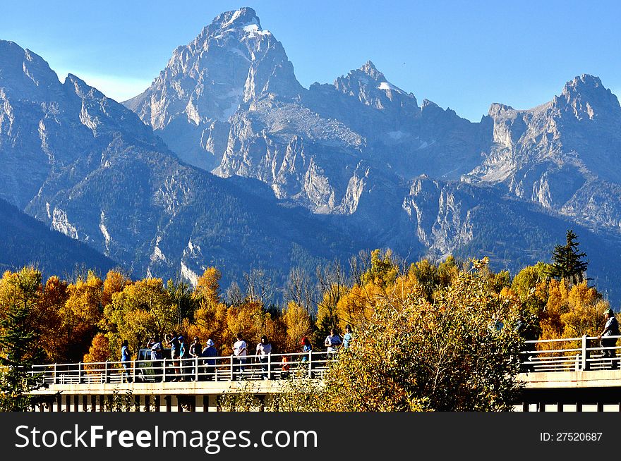 A group of tourists sightseeing in The Grand Tetons. A group of tourists sightseeing in The Grand Tetons.