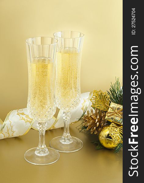 Christmas glasses with champagne and christmas decorations. Christmas glasses with champagne and christmas decorations.