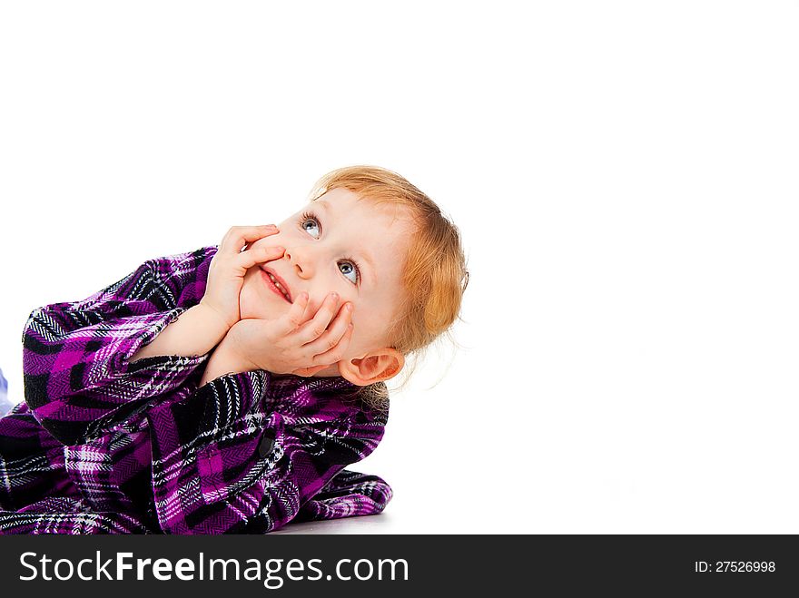 A little girl in a dress, looking from the outside, look at the top of isolated on white background