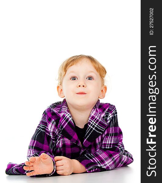 A little girl in a dress, a look of surprise isolated on white background