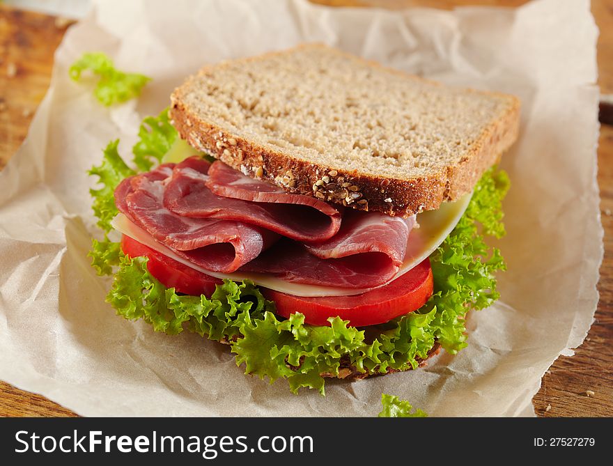 Fresh deli sandwich with tomatoes, swiss chees, lettuce