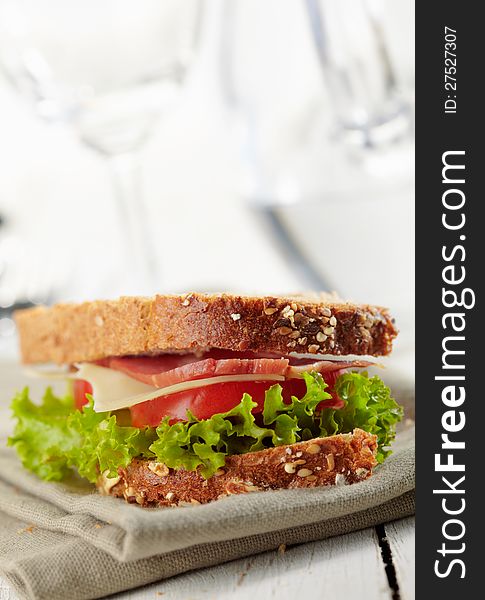 Fresh sandwich with tomatoes, swiss chees, lettuce. Fresh sandwich with tomatoes, swiss chees, lettuce