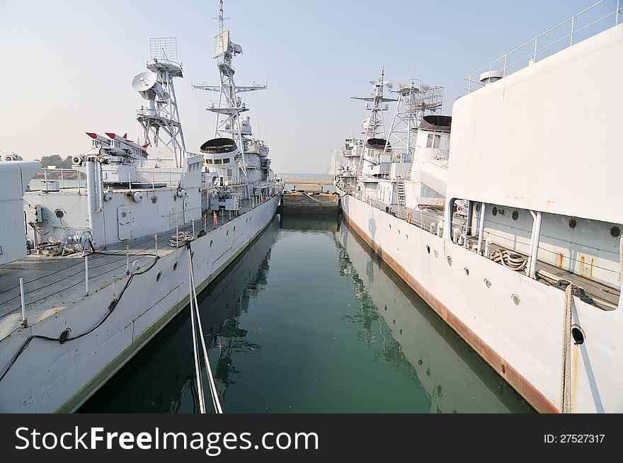 Two warships docked at the pier，which taken in the Chinese Navy Museum. Two warships docked at the pier，which taken in the Chinese Navy Museum