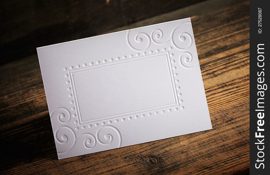 Blank Invitation on a old wooden background