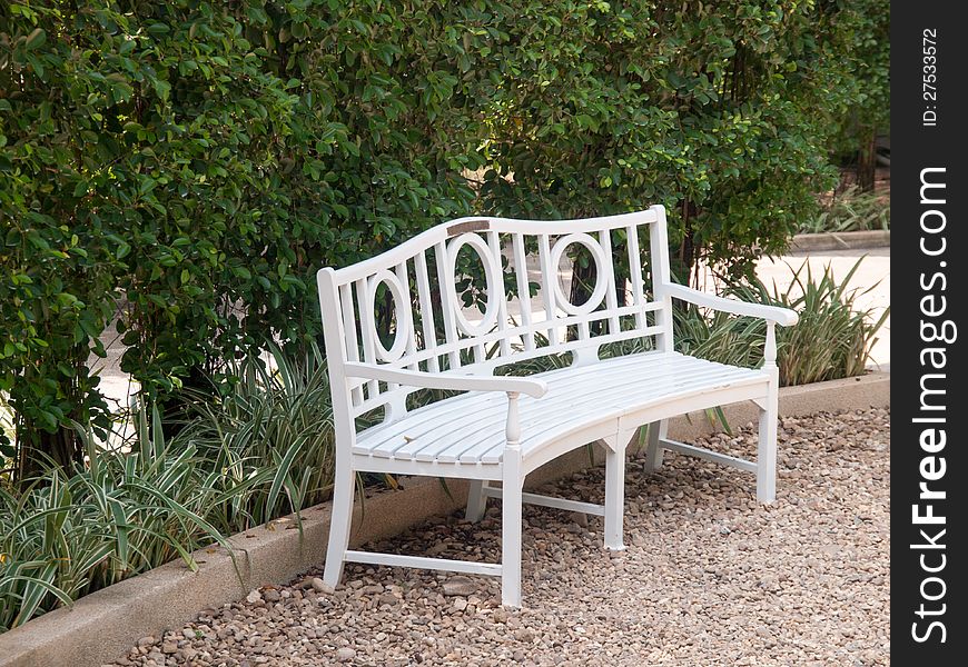 White wood bench in garden