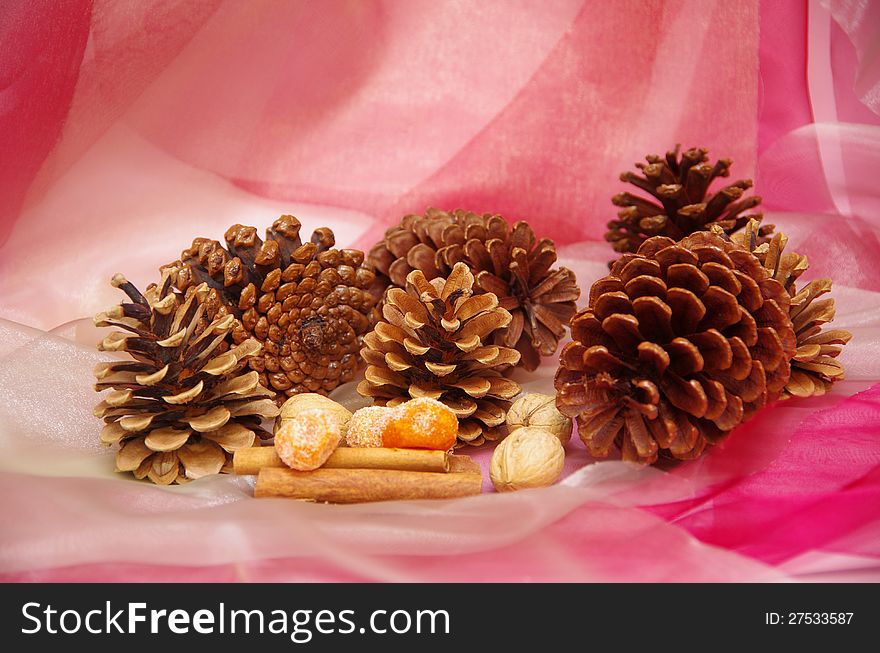 Christmas decoration with pine cones, cinnamon and dried fruit. Christmas decoration with pine cones, cinnamon and dried fruit.