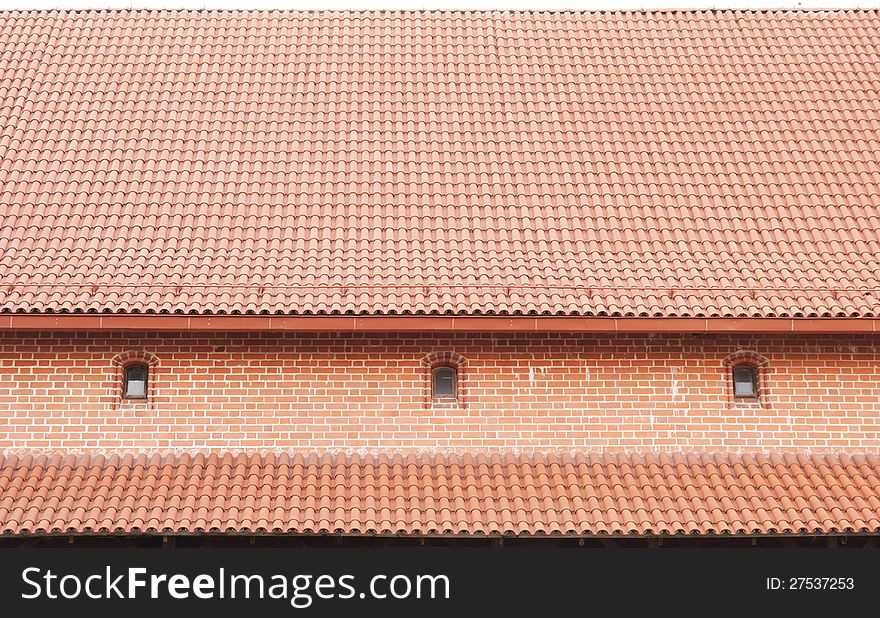 The roof is covered with tiles, background