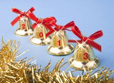 Christmas Golden Bells And Red Ribbon Royalty Free Stock Image