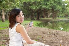 Asian Woman With Mobile Phone And Sitting At Park Stock Image Asian Woman With Mobile Phone And Sitting At Park Stock Image