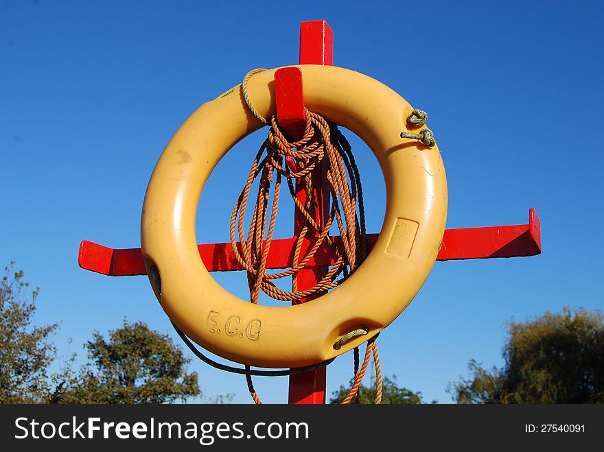 Rubber survival ring, blue sky in background. Rubber survival ring, blue sky in background