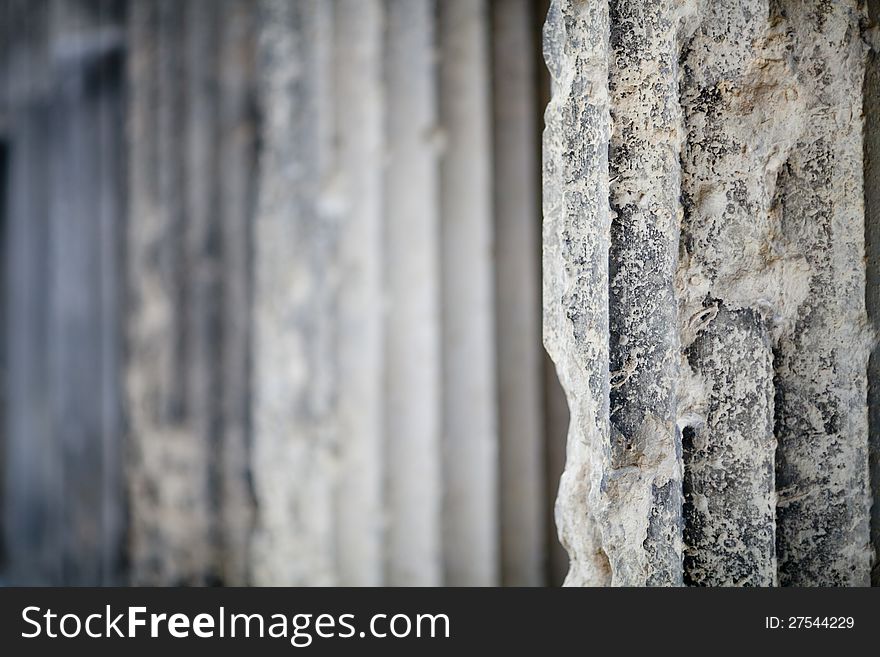 Antique stone column background with blurred perspective