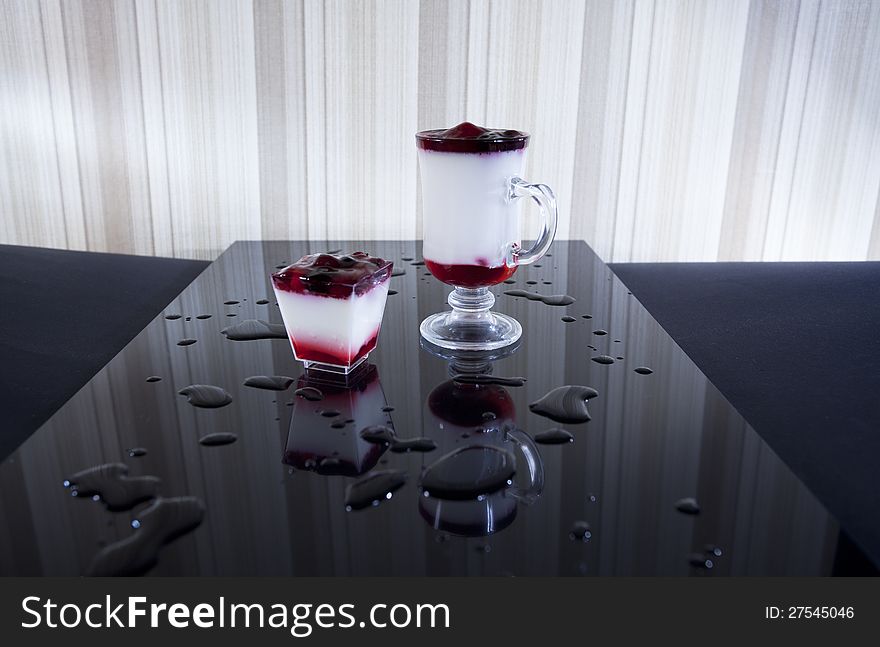 Two glasses with fruit cocktails isolated on black background. Two glasses with fruit cocktails isolated on black background