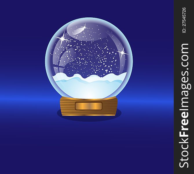 glass christmas ball with snow inwardly on a blue background