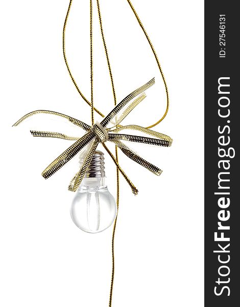 Idea lamp with a festive bow and disheveled golden rope isolated on white. Idea lamp with a festive bow and disheveled golden rope isolated on white.