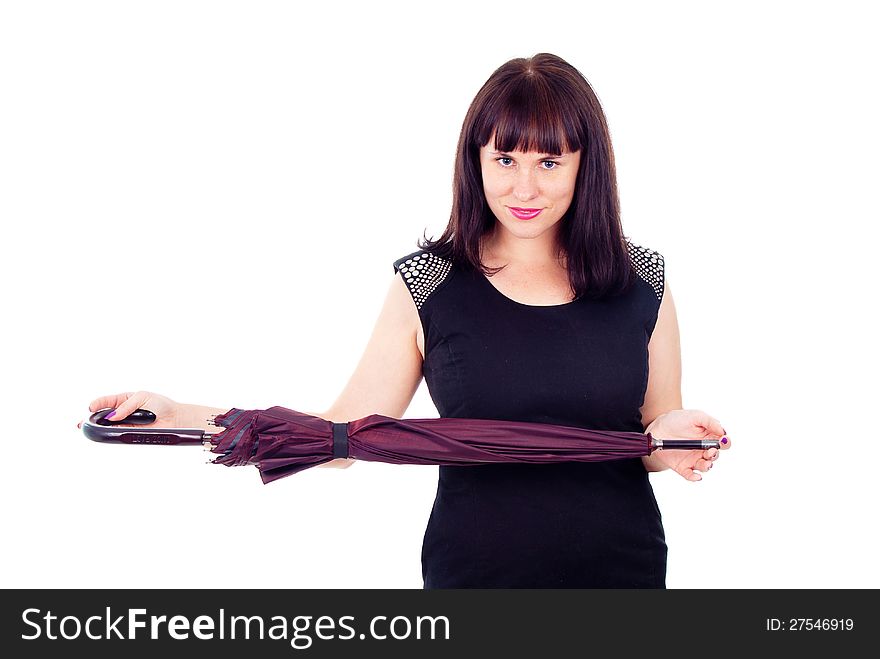 Beautiful girl standing with closed umbrella