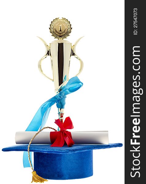1st. place golden winner cup, blue graduate cap & diploma with a red ribbon isolated on white. 1st. place golden winner cup, blue graduate cap & diploma with a red ribbon isolated on white.