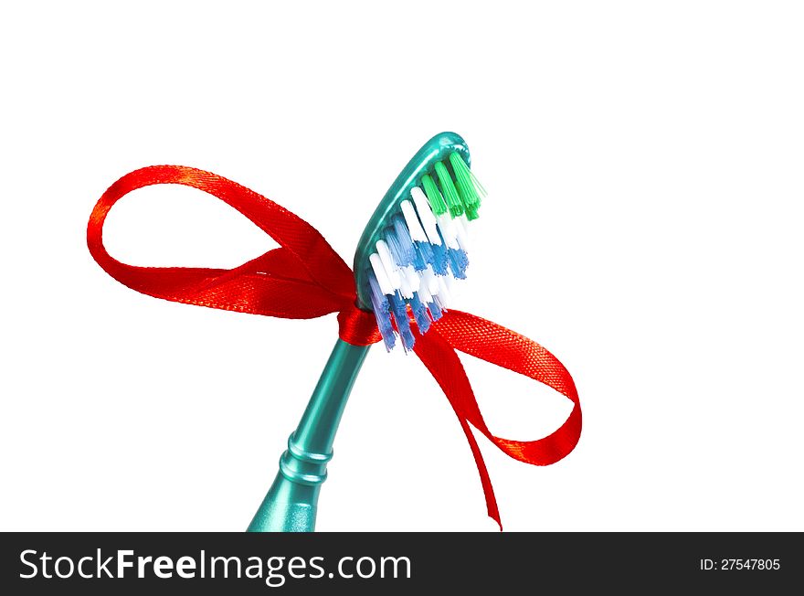 Festive toothbrush with a red ribbon in a bow form