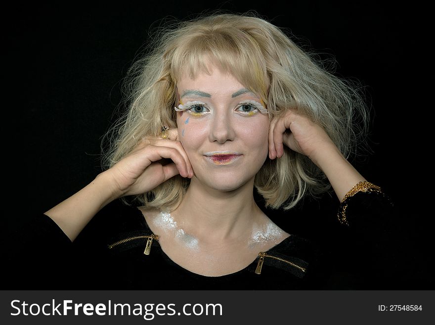 Girl with light hair in a make-up of an angel. Girl with light hair in a make-up of an angel