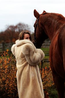 Formal Young Lady And Her Chestnut Horse Royalty Free Stock Images